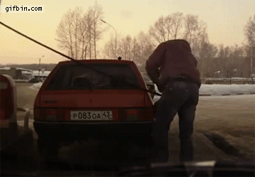 1391620247_russian_guy_lifts_car_at_gas_station.gif